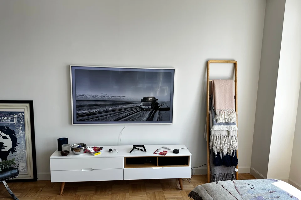 Television above a white media console